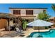 Backyard oasis featuring a private pool, covered patio, and lush landscaping perfect for relaxing and entertaining outdoors at 861 E Indian Wells Pl, Chandler, AZ 85249