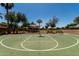 Community basketball court surrounded by mature trees offering a recreational space for active residents at 861 E Indian Wells Pl, Chandler, AZ 85249