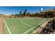 Outdoor basketball court with well-maintained surface, fencing, and seating at 861 E Indian Wells Pl, Chandler, AZ 85249