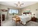 Inviting bedroom with neutral tones, a ceiling fan, and a view to the exterior at 861 E Indian Wells Pl, Chandler, AZ 85249