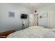 Comfortable bedroom featuring a TV, a mirror and a decorative bedspread at 861 E Indian Wells Pl, Chandler, AZ 85249