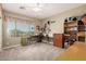 Bright bedroom with a ceiling fan, large window, and carpeted floors, perfect for work and relaxation at 861 E Indian Wells Pl, Chandler, AZ 85249