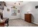 Cozy bedroom with neutral carpet, ceiling fan, and classic wooden dresser at 861 E Indian Wells Pl, Chandler, AZ 85249