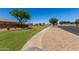 Scenic community featuring green spaces, walking path, and well-maintained landscaping at 861 E Indian Wells Pl, Chandler, AZ 85249
