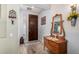 Charming entryway with a wooden door, antique mirror, and decorative accents for a welcoming ambiance at 861 E Indian Wells Pl, Chandler, AZ 85249
