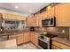 Spacious kitchen with light wood cabinets and plenty of countertop space at 861 E Indian Wells Pl, Chandler, AZ 85249