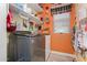 Well-organized laundry room with a modern washer and dryer, shelving, and colorful decor at 861 E Indian Wells Pl, Chandler, AZ 85249