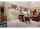 Another view of the living room with a chandelier, large windows, and furniture at 861 E Indian Wells Pl, Chandler, AZ 85249
