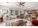 Cozy living room area with tile-top coffee table, neutral paint, and lots of natural light at 861 E Indian Wells Pl, Chandler, AZ 85249