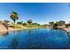 Scenic pond featuring lush landscaping and mature trees creating a tranquil atmosphere for relaxation and enjoyment at 861 E Indian Wells Pl, Chandler, AZ 85249