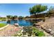 Beautiful community pond with well-kept landscaping and rocks along the edge at 861 E Indian Wells Pl, Chandler, AZ 85249