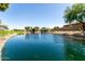 Community pond featuring lush landscaping and a serene atmosphere; perfect for a relaxing stroll at 861 E Indian Wells Pl, Chandler, AZ 85249