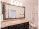 Bathroom featuring a decorative mirror, vanity, and a shower-tub combination at 8744 W Superior Ave, Tolleson, AZ 85353