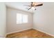 Bedroom featuring hardwood floors, a ceiling fan, and natural lighting at 8744 W Superior Ave, Tolleson, AZ 85353