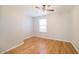Comfortable bedroom featuring hardwood floors, a ceiling fan, and natural lighting at 8744 W Superior Ave, Tolleson, AZ 85353