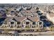 Bird's eye view of a vibrant neighborhood with well-maintained townhomes and landscaping at 9835 E Wavelength Ave, Mesa, AZ 85212