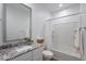 Bathroom with a single sink vanity, granite countertop, and a shower-tub combination at 9835 E Wavelength Ave, Mesa, AZ 85212