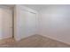 A bedroom featuring a sliding door closet and neutral-toned carpeting at 9835 E Wavelength Ave, Mesa, AZ 85212