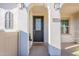 Inviting front entrance with stylish door, modern lighting, and decorative accents at 9835 E Wavelength Ave, Mesa, AZ 85212