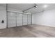 Spacious garage with an automatic door opener and ample room for vehicles at 9835 E Wavelength Ave, Mesa, AZ 85212
