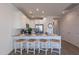 Modern kitchen featuring a breakfast bar, stainless steel appliances, and elegant granite countertops at 9835 E Wavelength Ave, Mesa, AZ 85212