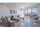 Inviting living space with a sliding glass door, comfortable seating arrangement, and stylish interior décor at 9835 E Wavelength Ave, Mesa, AZ 85212