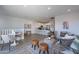 Open-concept living area featuring modern kitchen, comfortable lounge space, and inviting interior decor at 9835 E Wavelength Ave, Mesa, AZ 85212