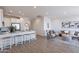 Open concept living room featuring modern decor, light wood floors, and bright, neutral color palette at 9835 E Wavelength Ave, Mesa, AZ 85212