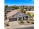 Expansive aerial view showcasing the home's prime location and well-maintained landscaping at 10046 E Posada Ave, Mesa, AZ 85212