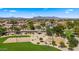 Community aerial view featuring a park with a volleyball and basketball court plus mountain views at 10046 E Posada Ave, Mesa, AZ 85212