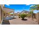 Secluded backyard with a pool and a lush desert landscape provides a private outdoor oasis at 10046 E Posada Ave, Mesa, AZ 85212