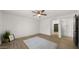 Spacious bedroom with neutral walls, ceiling fan, and modern decor at 10046 E Posada Ave, Mesa, AZ 85212
