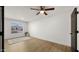 Bright bedroom with a ceiling fan, modern decor, and a large window at 10046 E Posada Ave, Mesa, AZ 85212