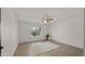 Bedroom with ceiling fan and lots of space with wood-look flooring at 10046 E Posada Ave, Mesa, AZ 85212