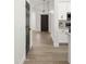 Hallway featuring luxury vinyl plank flooring and modern white cabinets at 10046 E Posada Ave, Mesa, AZ 85212