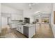 Bright kitchen features granite countertops, stainless steel appliances, and an island with bar seating at 10046 E Posada Ave, Mesa, AZ 85212