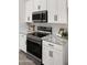 Modern kitchen appliances, including a stainless steel oven, microwave, and cooktop, with granite countertops at 10046 E Posada Ave, Mesa, AZ 85212