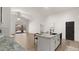 Open concept kitchen with island, granite countertops, and modern black faucet fixtures at 10046 E Posada Ave, Mesa, AZ 85212