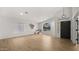 Bright living room with archway, wood-look floors, and neutral decor at 10046 E Posada Ave, Mesa, AZ 85212
