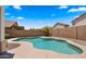 Sparkling swimming pool surrounded by lush landscaping, providing a private and tranquil oasis at 10046 E Posada Ave, Mesa, AZ 85212