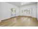 Bright bedroom featuring wood floors, a ceiling fan, and french doors to the yard at 10300 N 48Th Pl, Paradise Valley, AZ 85253