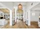 Bright and airy foyer with vaulted ceilings, decorative lighting, and an open view into multiple living spaces at 10300 N 48Th Pl, Paradise Valley, AZ 85253