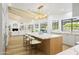 The bright kitchen boasts a marble island with seating and stainless steel appliances at 10300 N 48Th Pl, Paradise Valley, AZ 85253