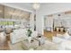 Open concept living room with hardwood floors, vaulted ceilings, and seamless access to other living areas at 10300 N 48Th Pl, Paradise Valley, AZ 85253