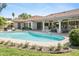 Inviting backyard pool, lounge chairs, and covered patio, perfect for relaxation and entertaining at 10300 N 48Th Pl, Paradise Valley, AZ 85253