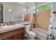 Bathroom featuring a shower over tub, vanity with countertop, and large mirror at 12809 W Oyer Ln, Peoria, AZ 85383