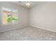 Simple bedroom design with a window overlooking the front yard and plush carpeting at 12809 W Oyer Ln, Peoria, AZ 85383