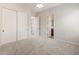 Neutral bedroom with plush carpeting, ceiling fan and a closet for storage at 12809 W Oyer Ln, Peoria, AZ 85383