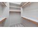 Walk-in closet with ample shelving and organized storage space at 12809 W Oyer Ln, Peoria, AZ 85383