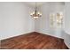 Formal dining room with chandelier lighting and hardwood floors at 12809 W Oyer Ln, Peoria, AZ 85383
